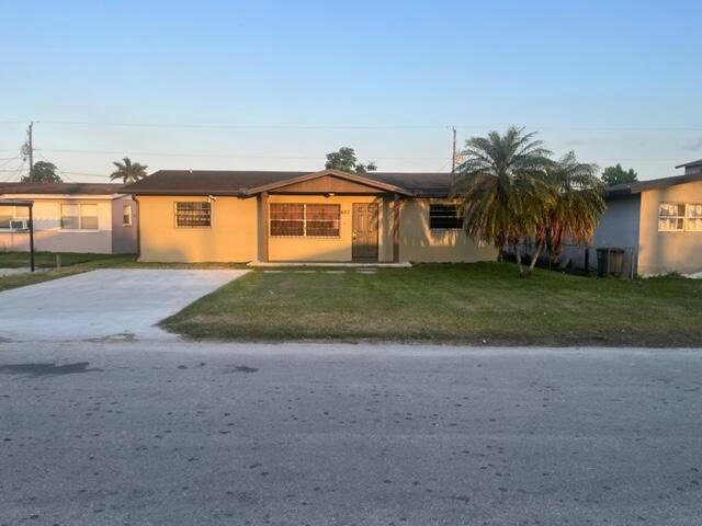 621 SW 7TH ST, BELLE GLADE, FL 33430, photo 1 of 15